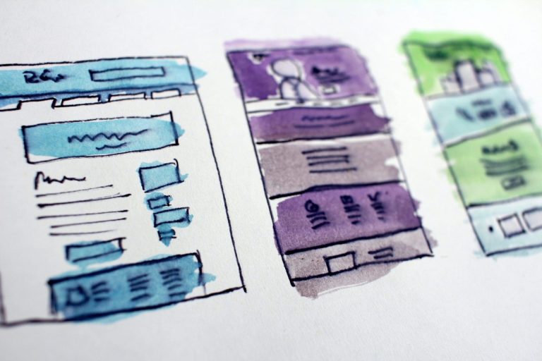Hand-drawn website and sales funnel wireframes in blue, purple, and green representing different stages of a digital marketing strategy and a website vs sales funnel.